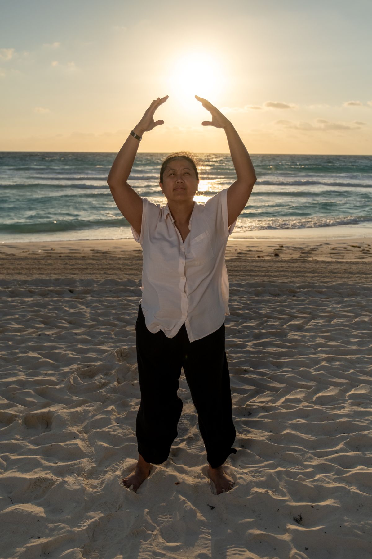 Melissa Roxas on the beach at sunrise